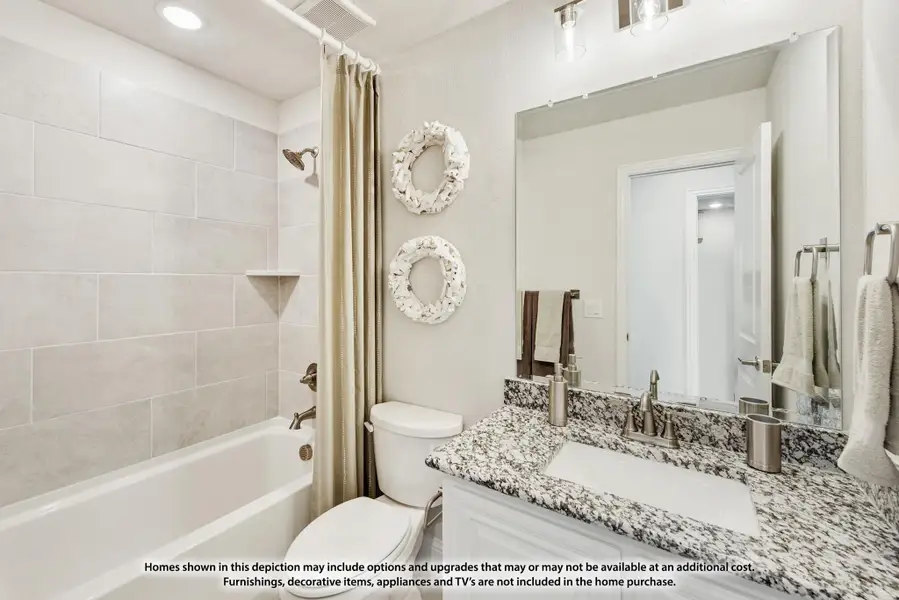 Bathroom with granite vanity, tiled tub-shower combo, large mirror, and neutral decor Bathroom with granite vanity, tiled tub-shower combo, large mirror, and neutral decor