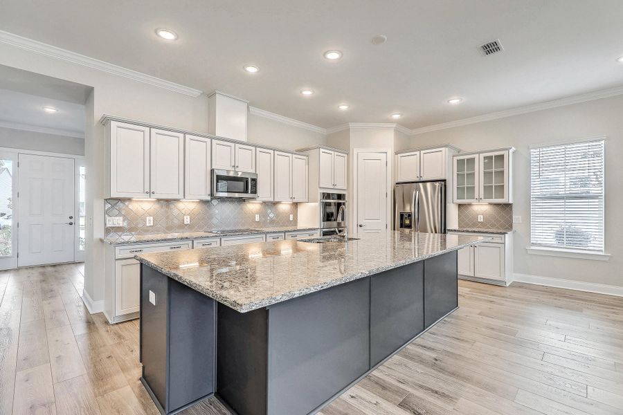 Furnished interior view inside a new home in K. Hovnanian's® Four Seasons at Lakes of Cane Bay, Summerville (Image 12).