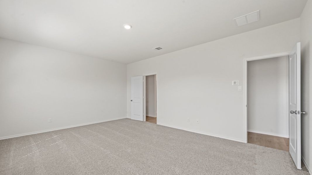 Representative unfurnished interior of a home built from the Oak Leaf by D.R. Horton in Enclave at Kings Fort, Kaufman (Image 11).