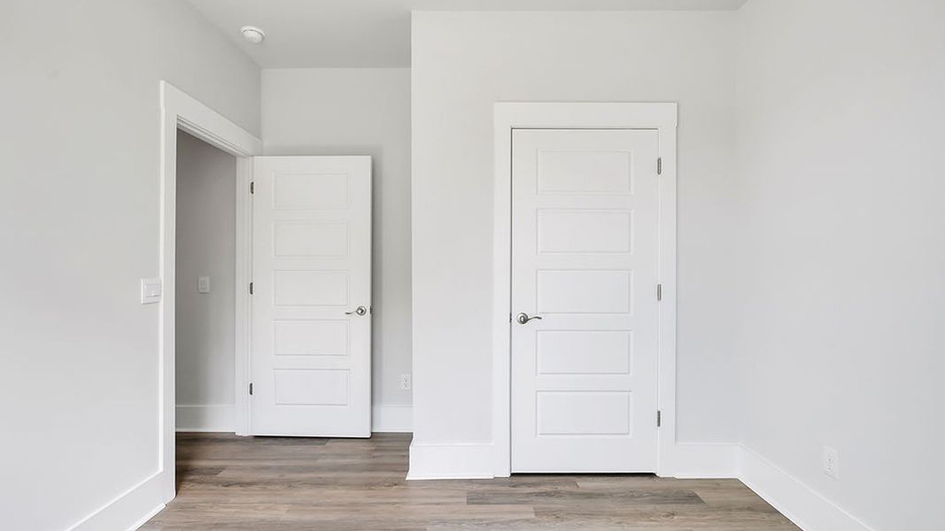 Representative unfurnished interior of a home built from the BRADFORD by D.R. Horton in Indigo Preserve, Leland (Image 18).