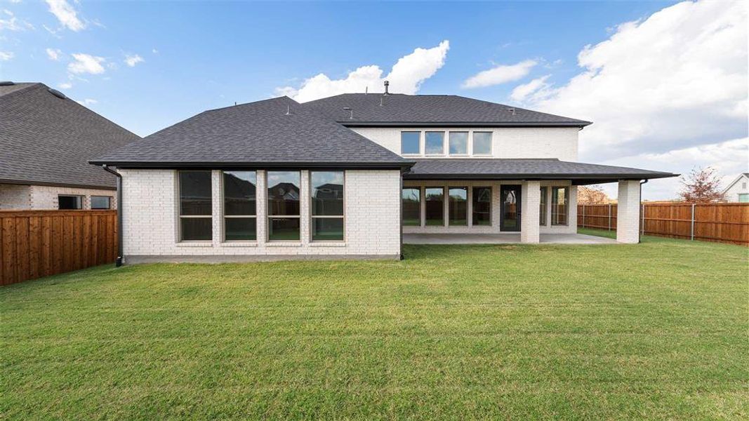 Exterior details and patio area of a home in Terraces 72', Rockwall (Image 2).