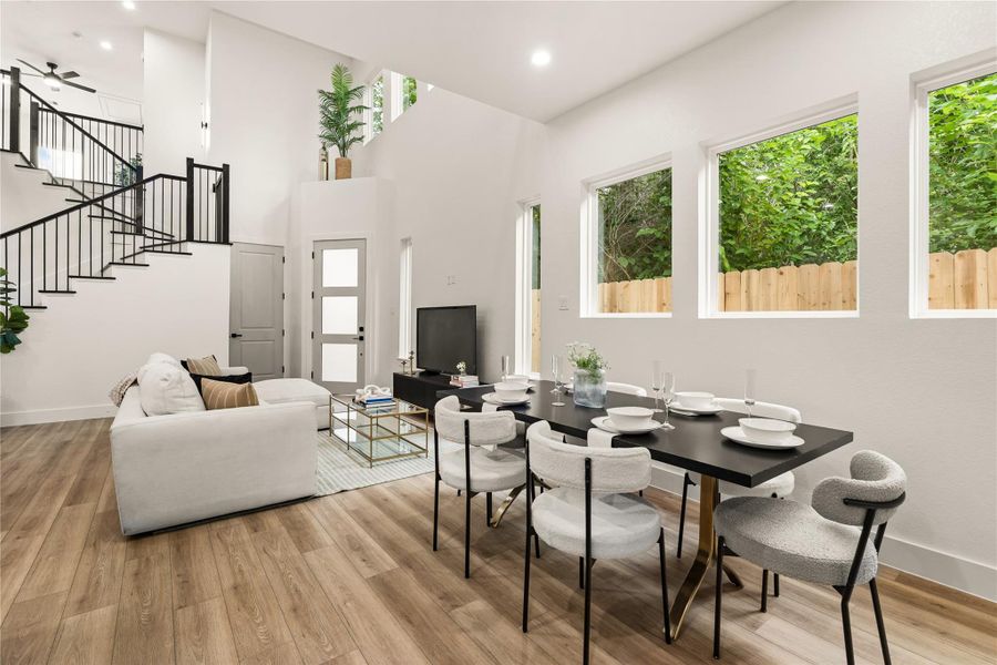 Dining area framed by tall windows — natural light and open flow throughout Dining area framed by tall windows — natural light and open flow throughout