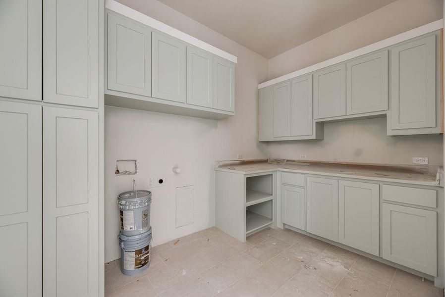 Large utility room with custom cabinets. Large utility room with custom cabinets.
