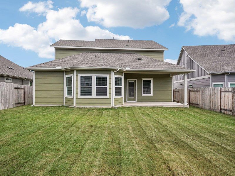 Exterior details and patio area of a home in Riverbend at Double Eagle - Boulevard Collection, Cedar Creek (Image 21). Exterior details and patio area of a home in Riverbend at Double Eagle - Boulevard Collection, Cedar Creek (Image 21).