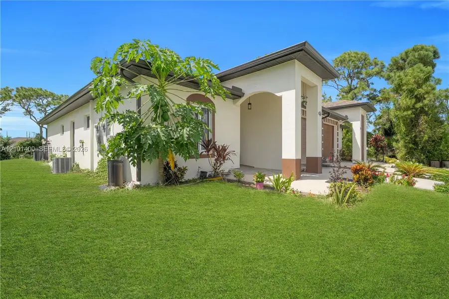 Exterior details and patio area of a home in , Lehigh Acres (Image 4).