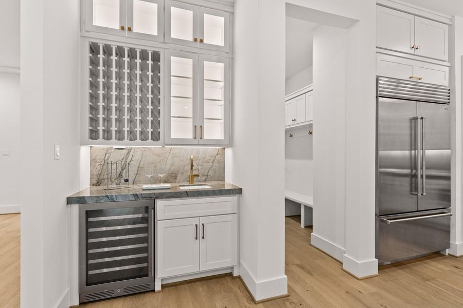 Butler pantry/serving area with wine cooler