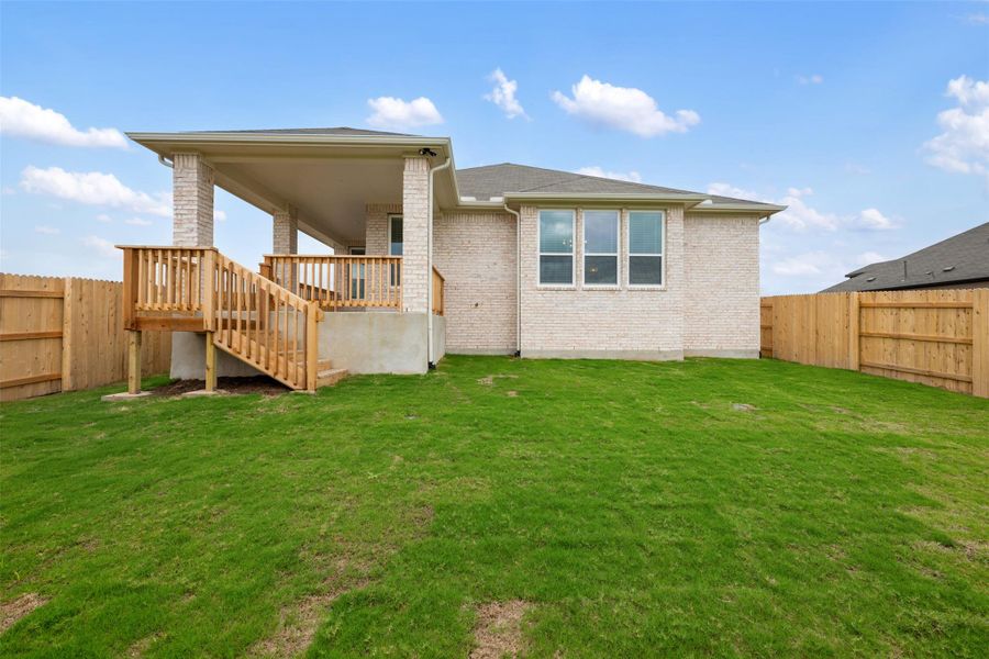 Exterior details and patio area of a home in Willow Springs, Buda (Image 12).