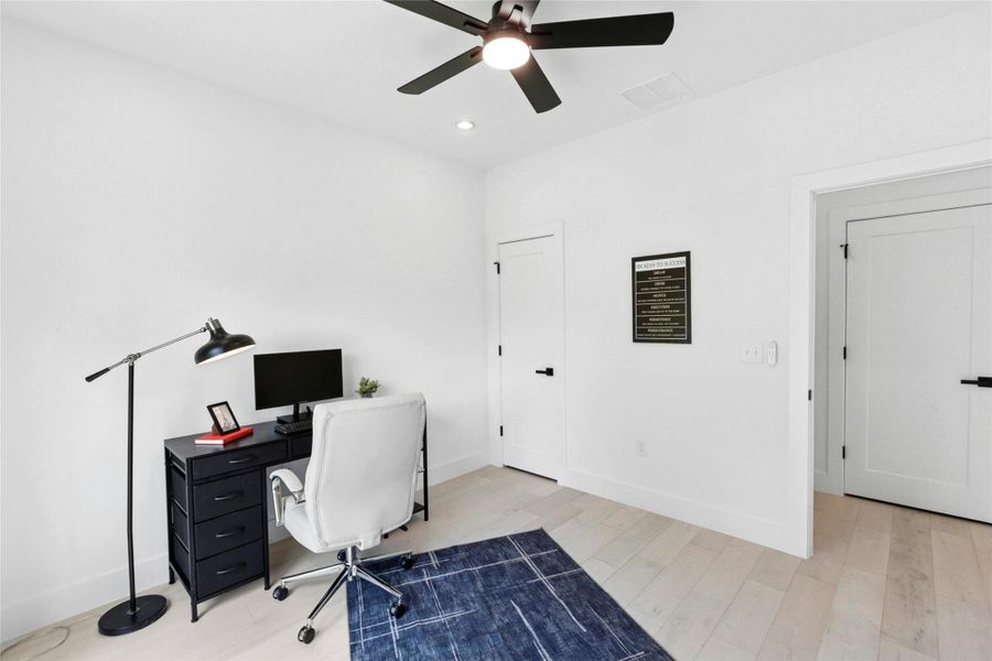 Office area featuring ceiling fan, light wood-style flooring, and recessed lighting
