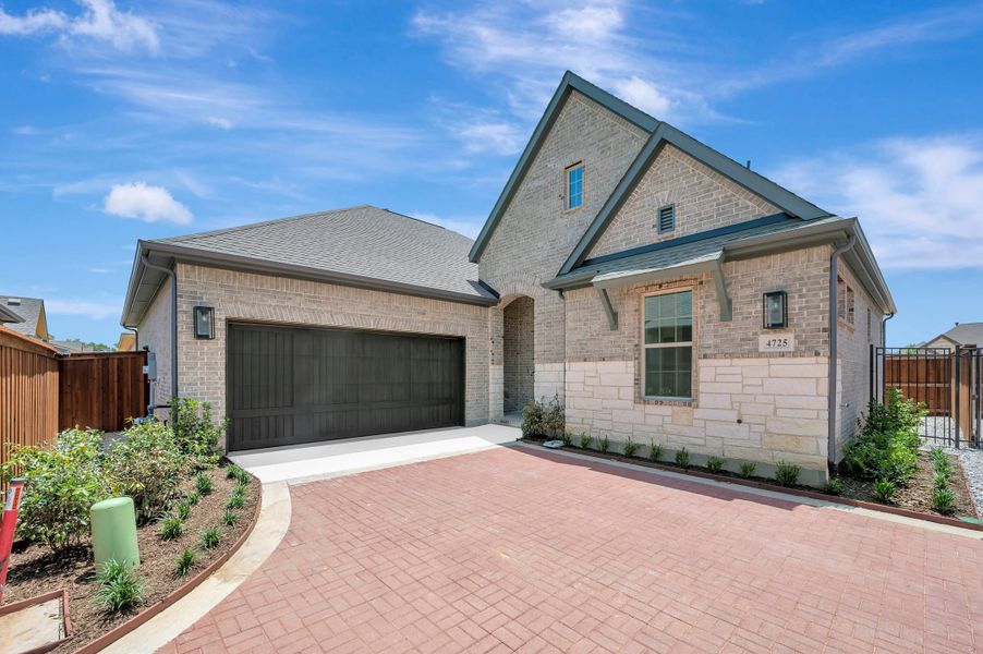 Front exterior of a new home in Elements at Viridian - Garden Series, Arlington, TX, highlighting curb appeal (Image 1). Front exterior of a new home in Elements at Viridian - Garden Series, Arlington, TX, highlighting curb appeal (Image 1).