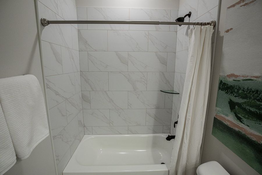 Representative furnished interior of a home built from the Willow by Grant & Co in Manor at Hall Creek, Arlington (Image 133).