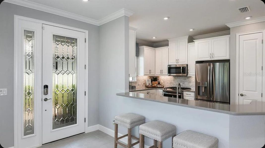 Furnished interior view inside a new home in Esplanade at Wellen Park, Englewood (Image 6).