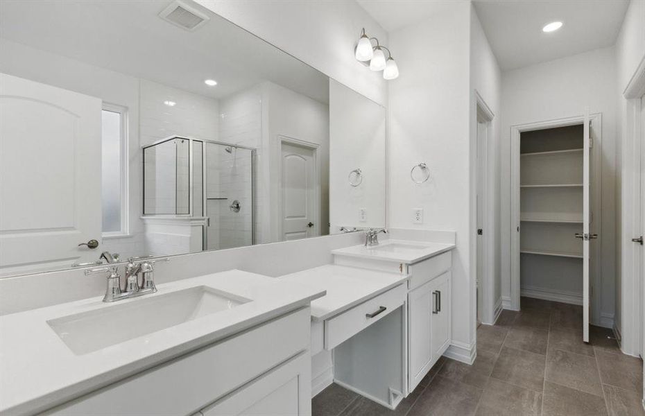 Owner's bathroom with dual vanity *real home pictured