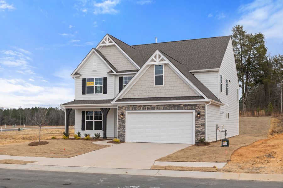 Front exterior of a new home in Wexford, Elon, NC, highlighting curb appeal (Image 26).