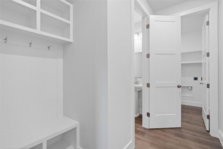 The ultimate in organization and cleanliness—a dedicated mudroom designed to manage daily life with ease. This space serves as the perfect "drop zone" between the garage and your main living areas, helping to keep your home tidy and clutter-free. The ultimate in organization and cleanliness—a dedicated mudroom designed to manage daily life with ease. This space serves as the perfect "drop zone" between the garage and your main living areas, helping to keep your home tidy and clutter-free.