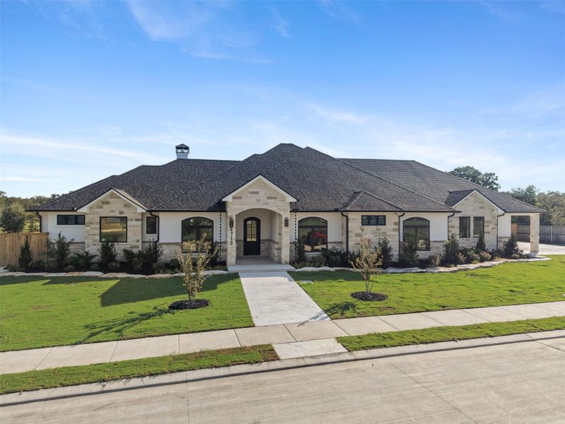 Front exterior of a new home in , College Station, TX, highlighting curb appeal (Image 27).
