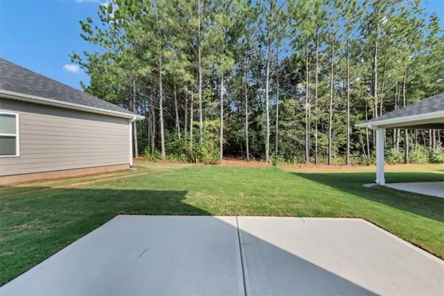Exterior details and patio area of a home in Canterbury Villas, Carrollton (Image 4).