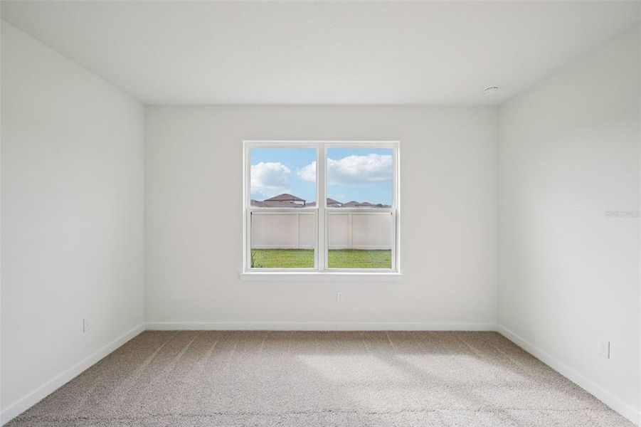 Spacious, unfurnished interior of a new home in Grasslands West, Lakeland (Image 24).