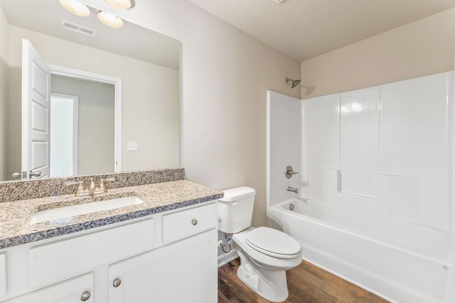 Bathroom on second level with a stand up tub