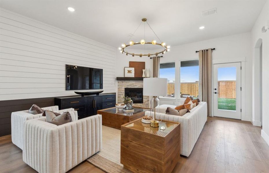 *Model Representation - Spacious gathering room with large windows