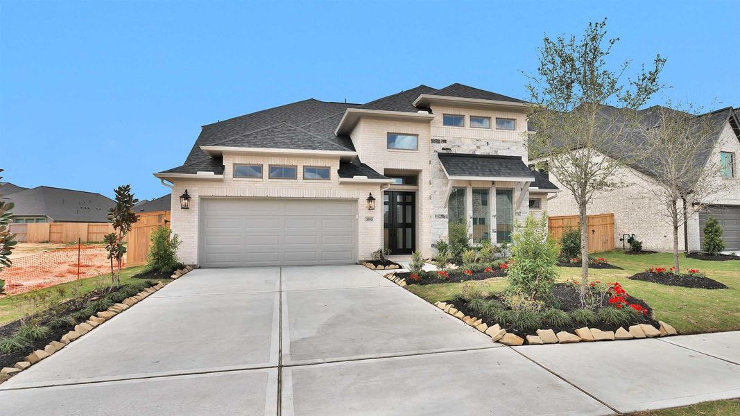Front exterior of a new home in Cross Creek West, Fulshear, TX, highlighting curb appeal (Image 2).