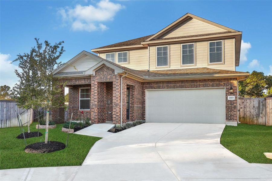 Front exterior of a new home in Magnolia Place, Magnolia, TX, highlighting curb appeal (Image 25).