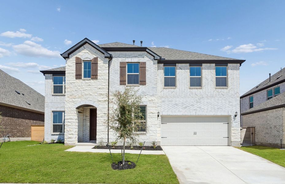 Front exterior of a new home in Bluffview Reserve, Leander, TX, highlighting curb appeal (Image 28).