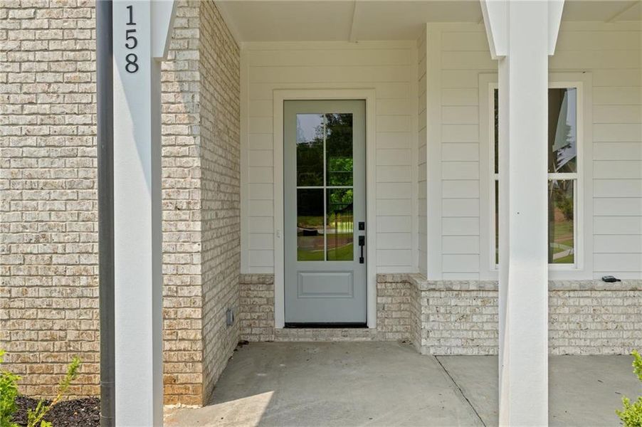 Front exterior of a new home in , Canton, GA, highlighting curb appeal (Image 1).