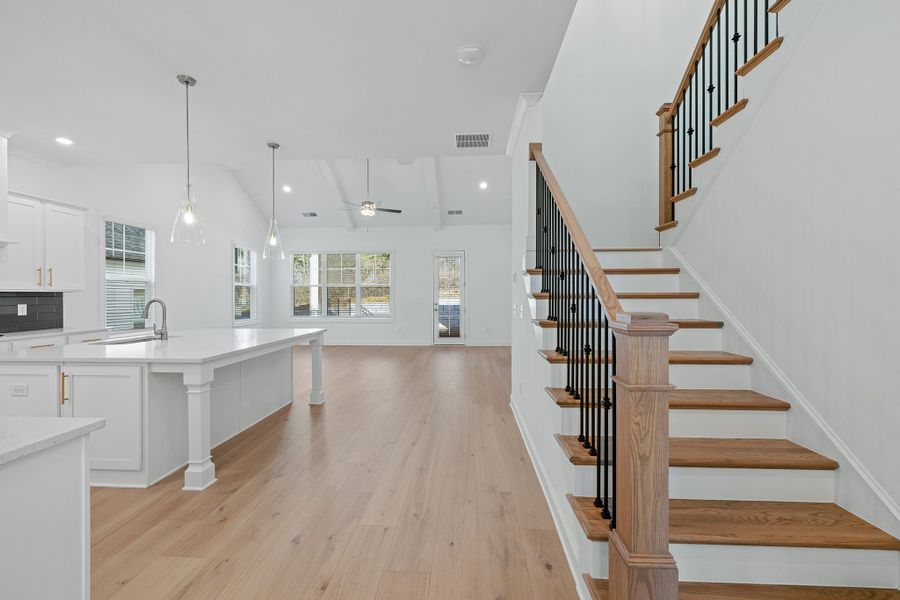 The foyer opens up to the kitchen and family room