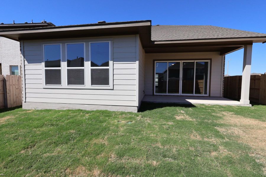 Exterior details and patio area of a home in Lariat, Liberty Hill (Image 4).