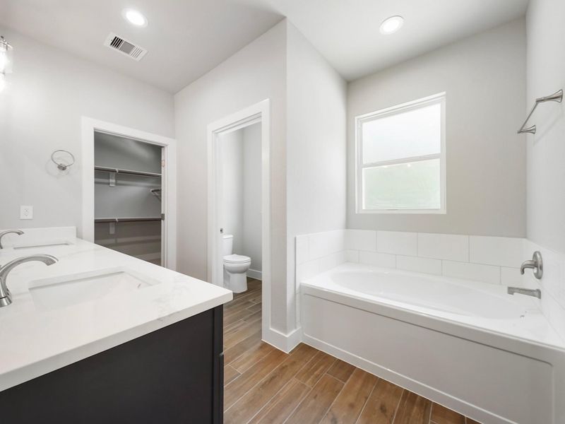 Bathroom is mix of navy blue and white cabinets Bathroom is mix of navy blue and white cabinets
