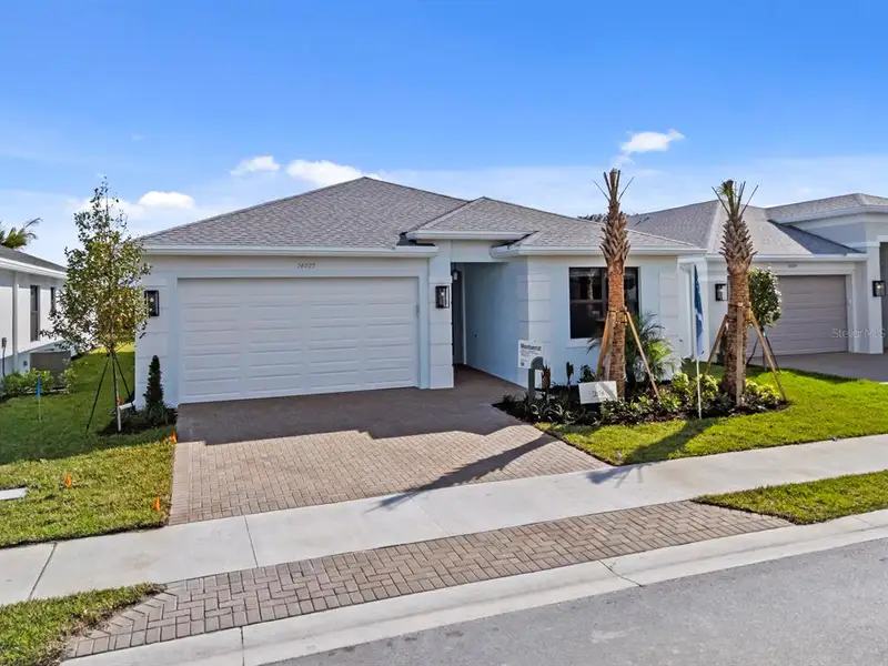 Front exterior of a new home in , Fort Myers, FL, highlighting curb appeal (Image 2).