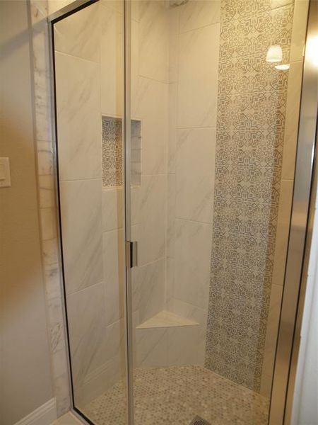 Bathroom featuring an enclosed shower