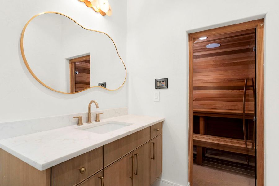 Bathroom featuring a sauna and vanity