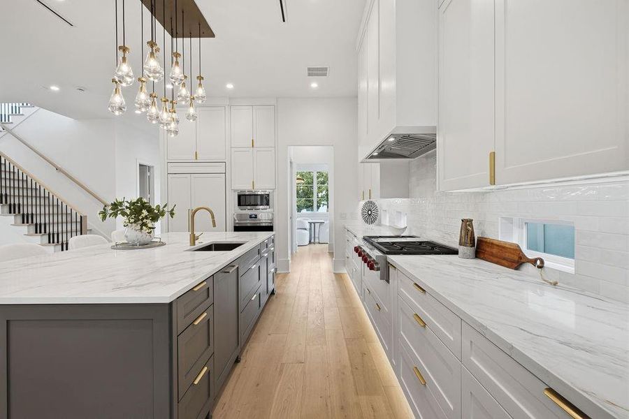 The Ultimate Chef’s Kitchen Experience the pinnacle of culinary performance with the industry’s most prestigious appliance suite.* Wolf Professional Range: Precision-engineered for high-output cooking and gourmet results.* Sub-Zero Integrated Refrigeration: The gold standard in food preservation, seamlessly paneled to match custom cabinetry.* Cove Dishwashing: Near-silent, professional-grade cleaning tucked discreetly behind a flush-mount cabinet front.