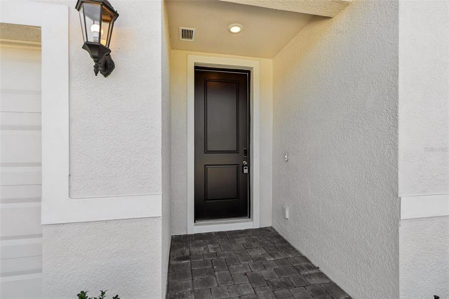 Exterior details and patio area of a home in The Reserve at Hammock Oaks - Signature Series, Lady Lake (Image 24).