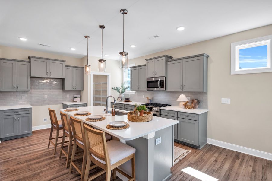 Representative furnished interior of a home built from the The Amherst by RobuckHomes in Windwater, Hampstead (Image 45).