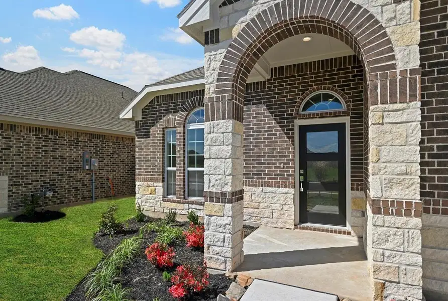 Exterior details and patio area of a home in Sunterra, Katy (Image 3).