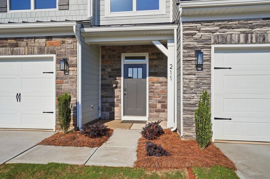 Exterior details and patio area of a home in Blythe Mill Townhomes, Waxhaw (Image 2).