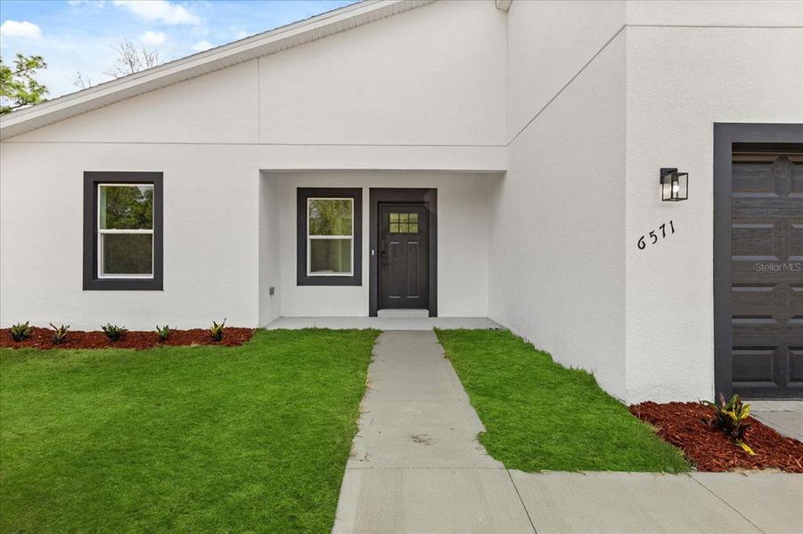 Front exterior of a new home in , Dunnellon, FL, highlighting curb appeal (Image 15).