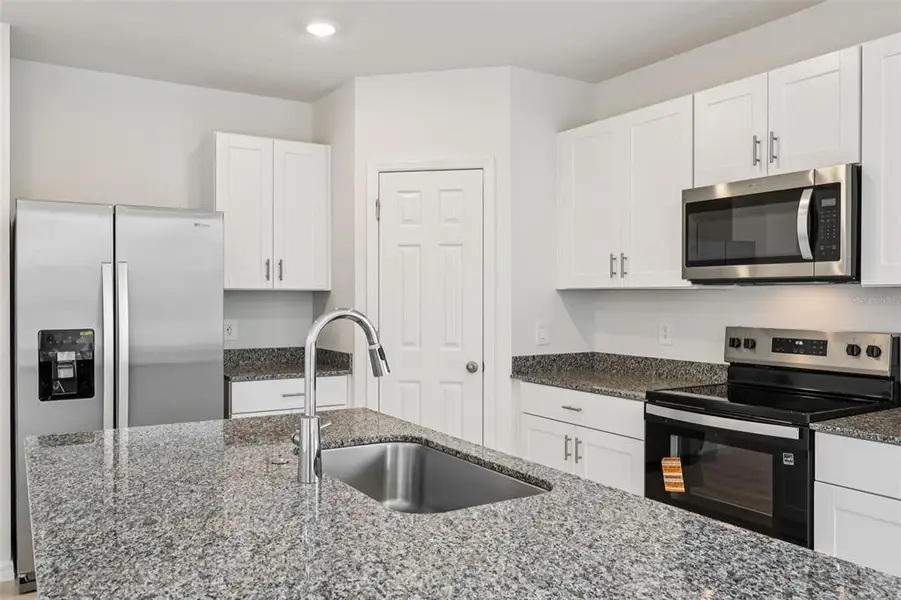 Furnished interior view inside a new home in Bradbury Creek - Signature Series, Haines City (Image 6).