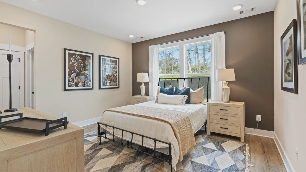 Eye-catching details and elegant finishes in the vibrant primary suite of this select home near Downtown Fountain Inn
