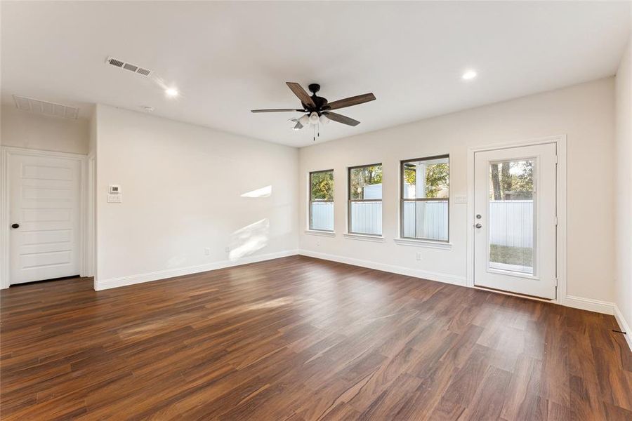 Spare room featuring dark wood-style flooring, recessed lighting, and ceiling fan