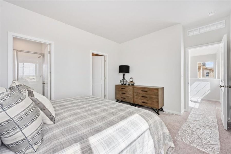 A bedroom with a bed and a dresser. A bedroom with a bed and a dresser.