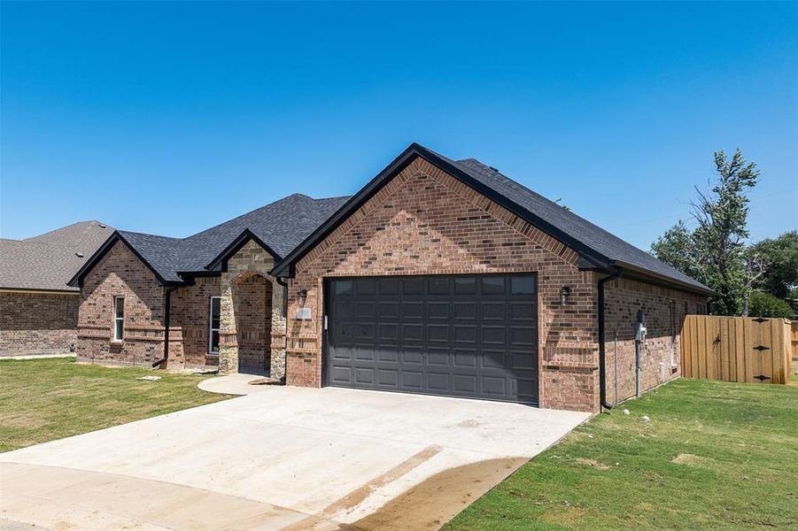Front exterior of a new home in , Mabank, TX, highlighting curb appeal (Image 2). Front exterior of a new home in , Mabank, TX, highlighting curb appeal (Image 2).
