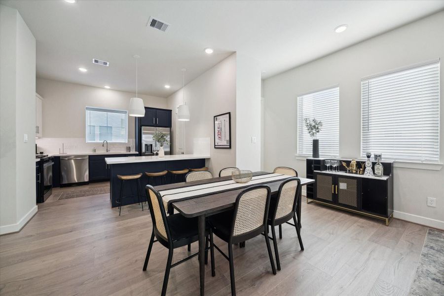 Representative photo showing the community’s model home kitchen/dining room. Layout and selections may vary.
