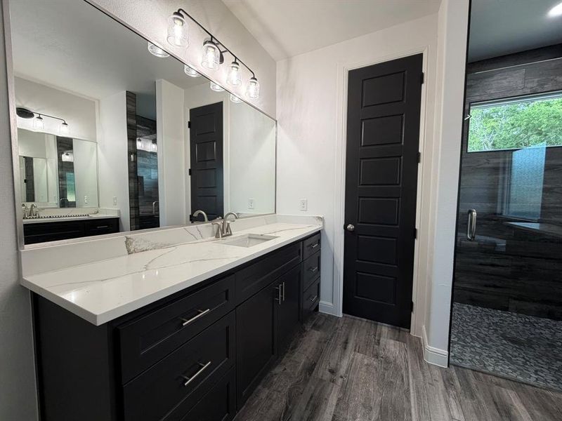 Dual vanity with a white countertop and integrated sinks