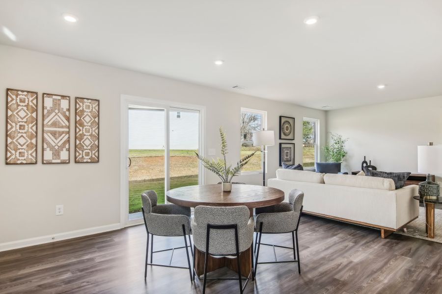 A living room with a couch and a table.