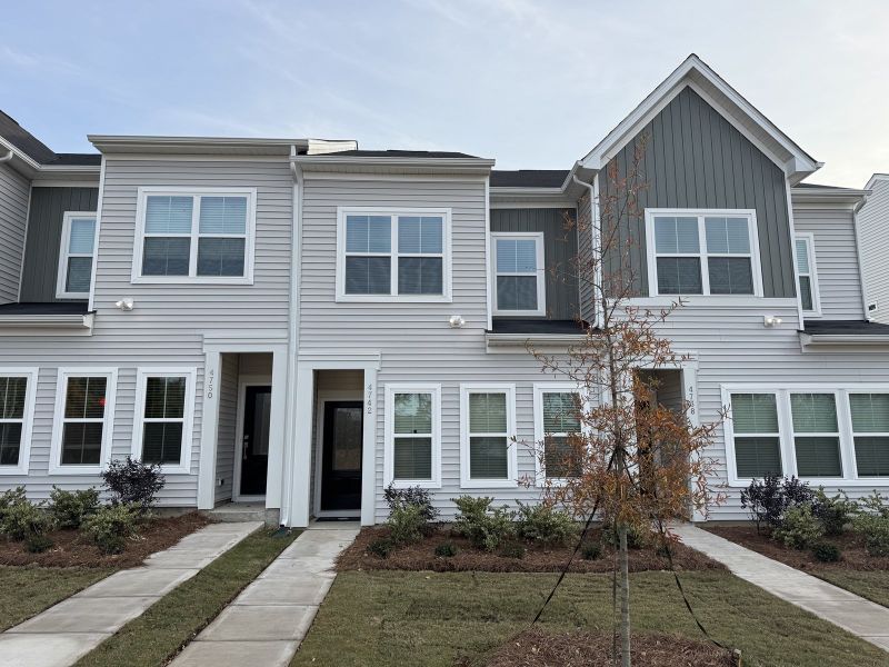Front exterior of a new home in Lakeview Village, Charlotte, NC, highlighting curb appeal (Image 1).