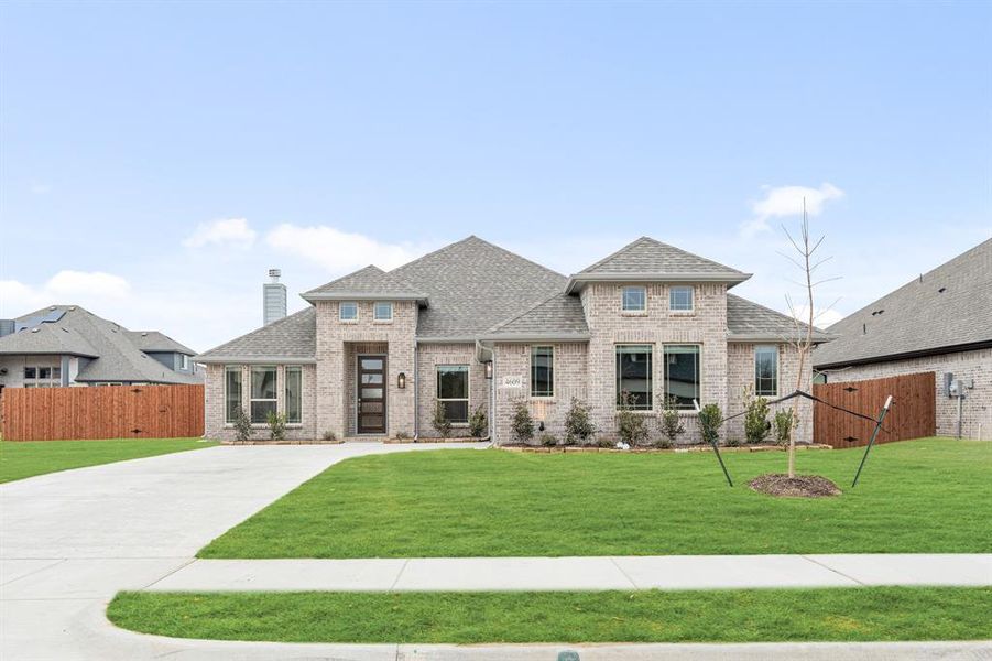 Front exterior of a new home in Ridgepoint, Midlothian, TX, highlighting curb appeal (Image 2).