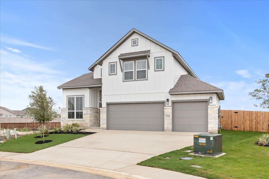 Front exterior of a new home in Village at Three Oaks, Seguin, TX, highlighting curb appeal (Image 16). Front exterior of a new home in Village at Three Oaks, Seguin, TX, highlighting curb appeal (Image 16).